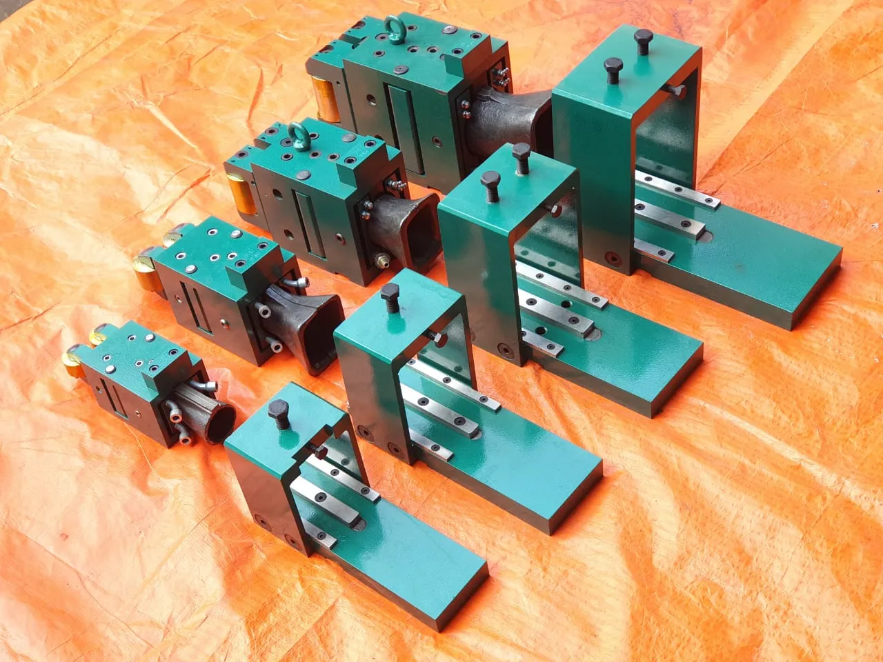 Set of guide boxes mounted on machined base plates
