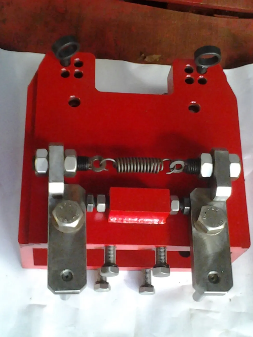 Spring-loaded roller guide assembly on its mounting plate