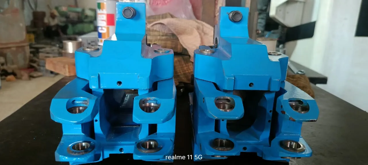 Pair of guide boxes opened to show the roller arrangement