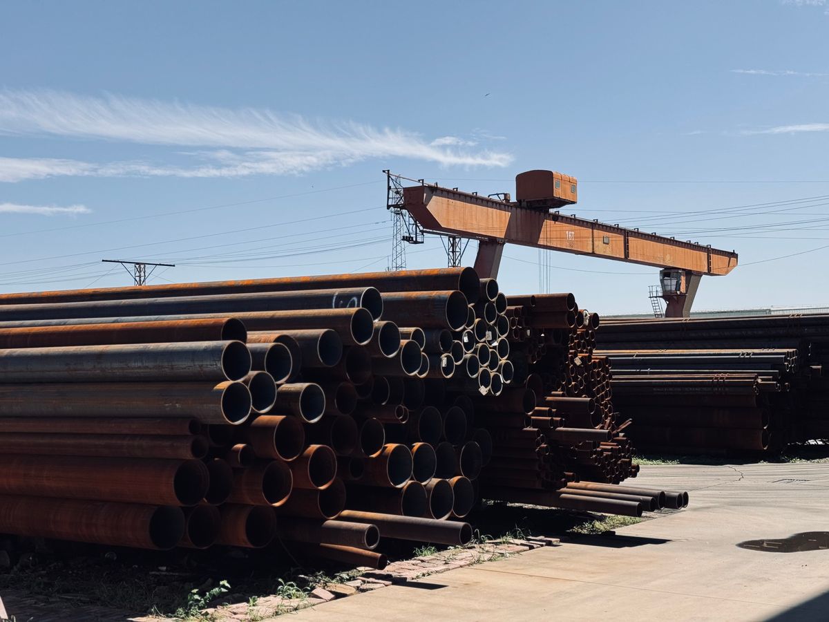 Steel pipes stored in an industrial manufacturing yard